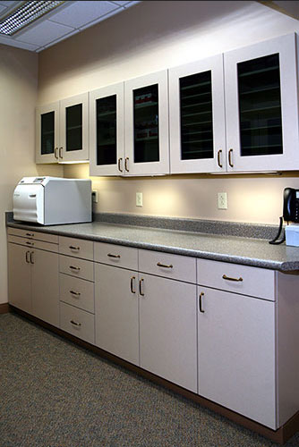 Autoclave and sanitized work room at {PRACTICE_NAME} office